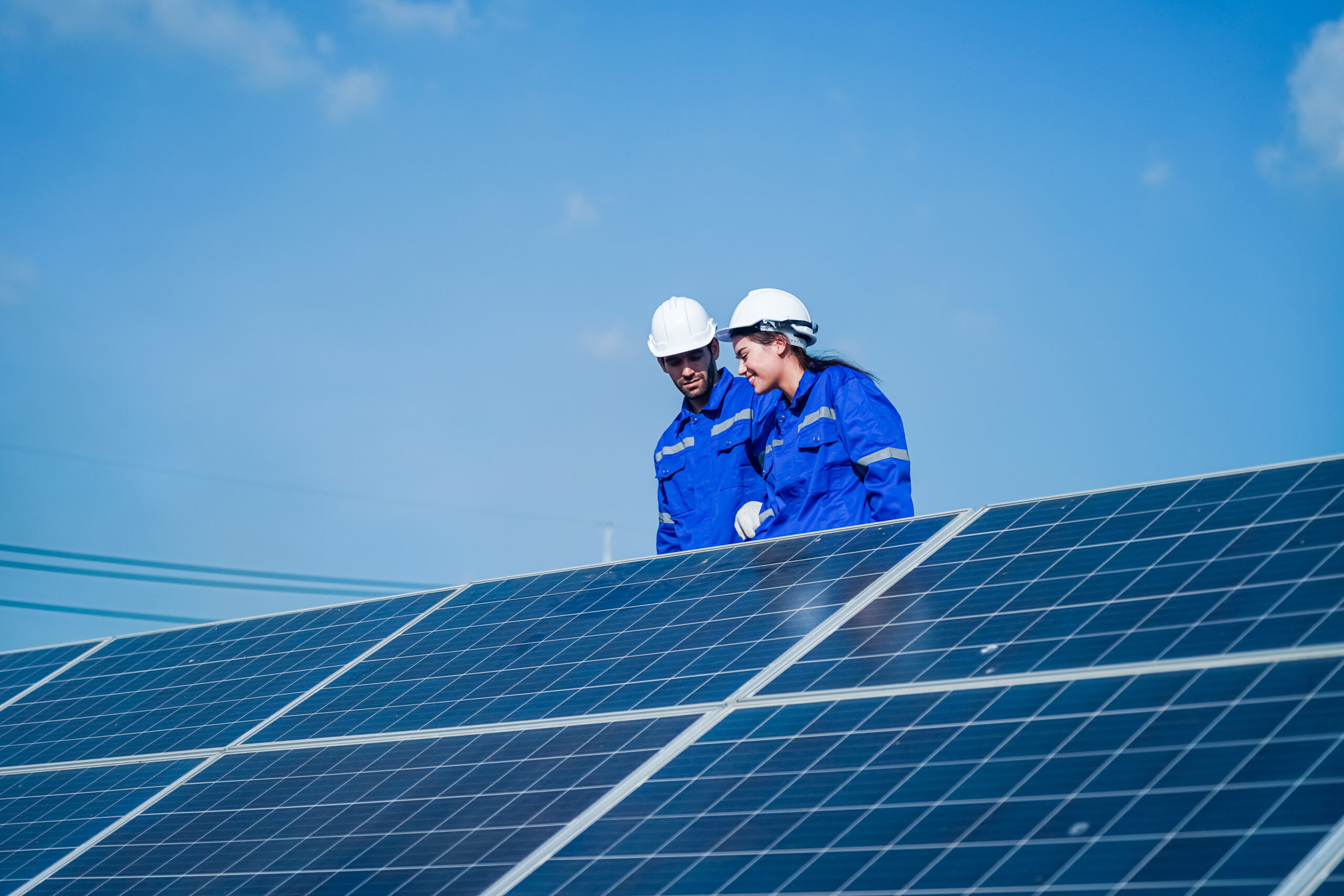 Technology solar cell, Engineer service check installation solar cell on the roof of factory. technician checks the maintenance of the solar panels